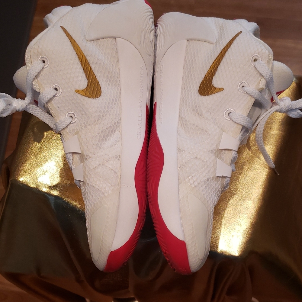 Nike White Trainers with Gold Swoosh and Red Soles